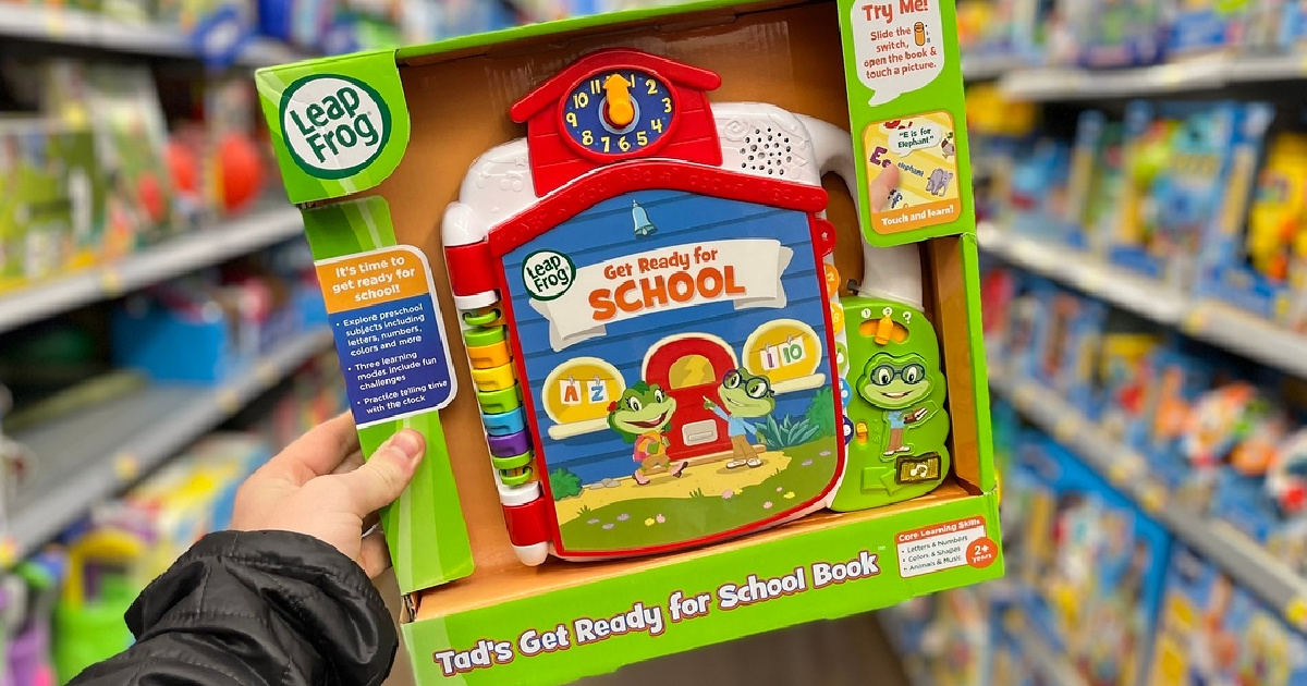 Leapfrog Tad's Get Ready for School Book held in hand in a store toy aisle