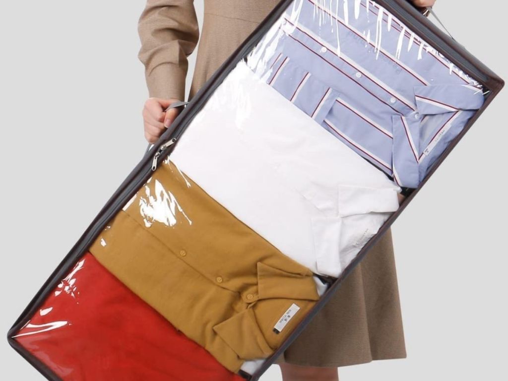 person holding Lifewit Bed Organizer filled with clothing