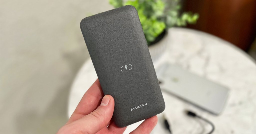 hands holding grey power bank