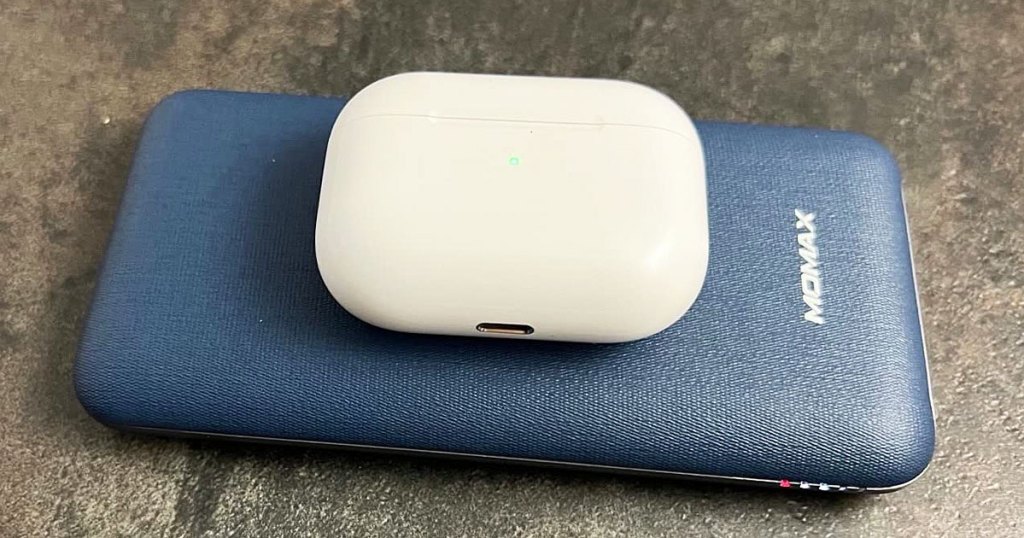 airpods on top of a blue power bank