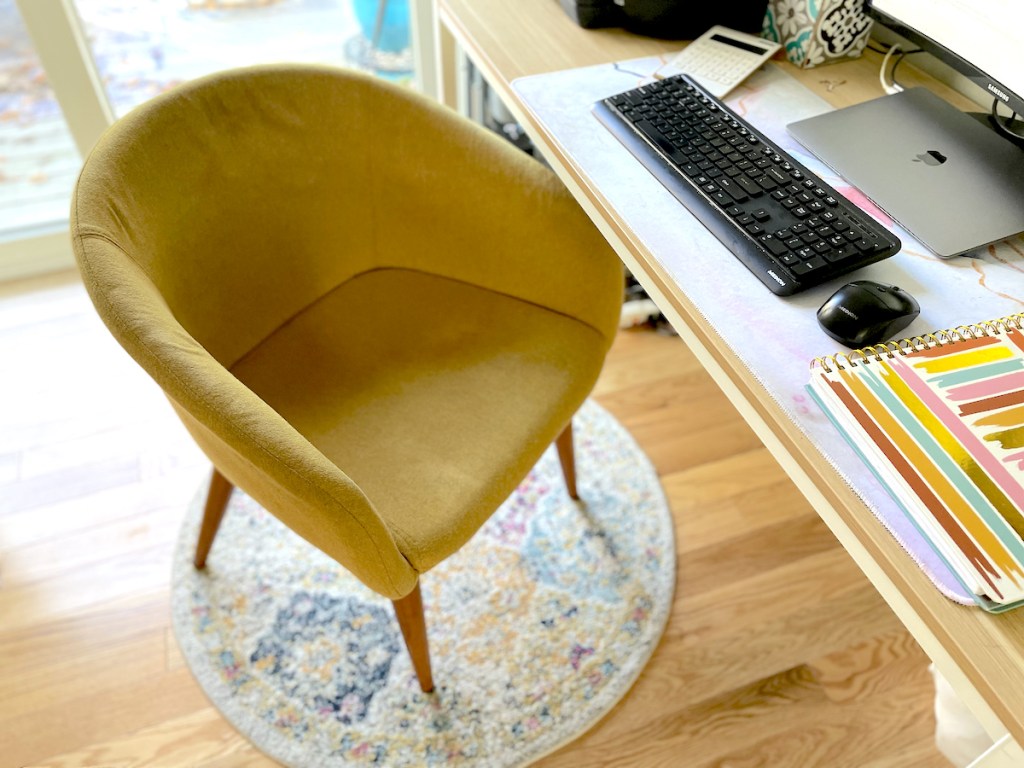 yellow upholstered chair in front of office desk