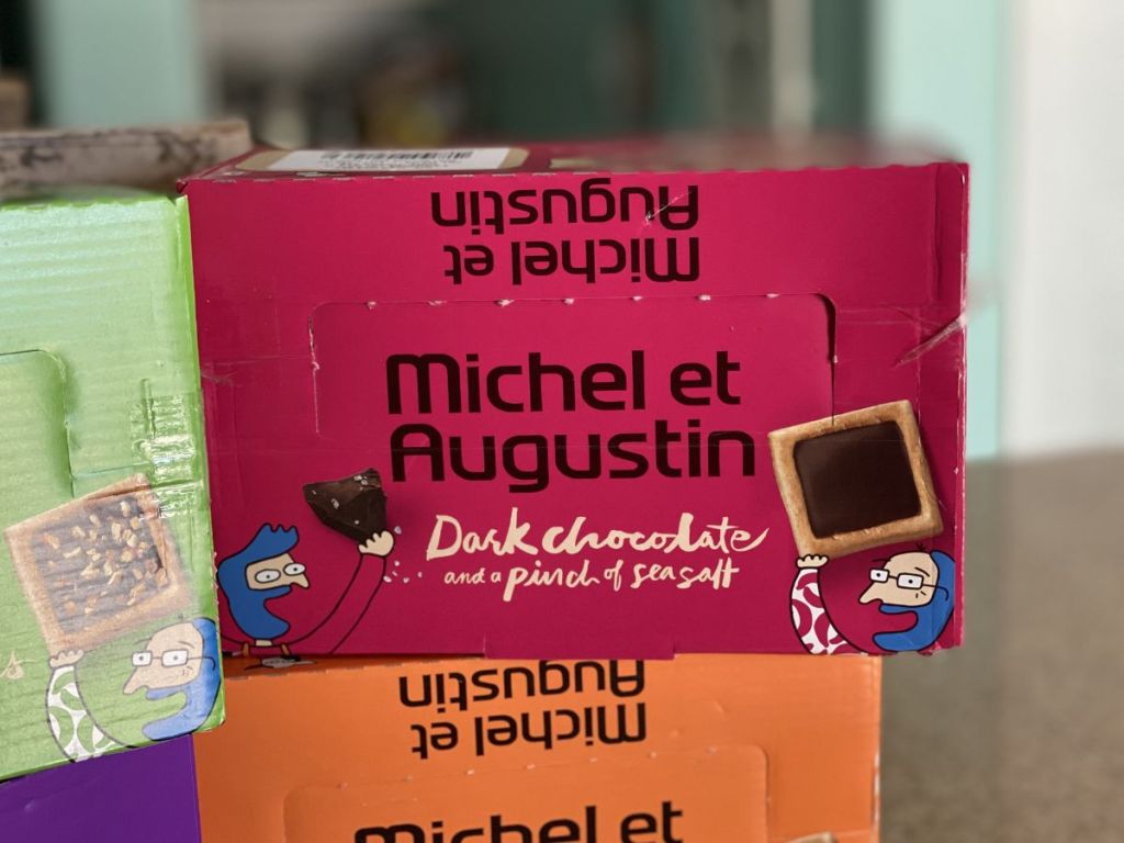 Michel et Augustin Gourmet Chocolate Cookie Squares dark chocolate and seasalt box stacked on other Michel et Augustin Gourmet Chocolate Cookie boxes