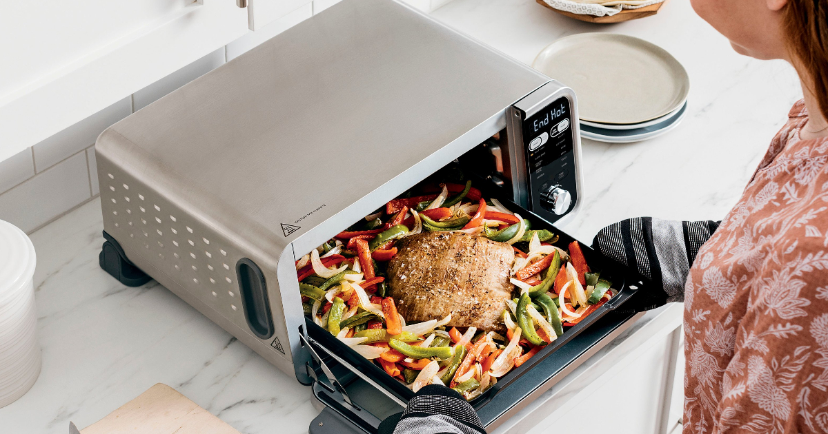 Ninja - Foodi Convection Toaster Oven on counter with roast and veggies