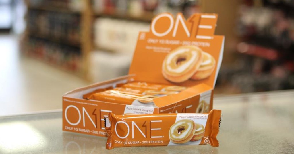 One Protein Buys Maple Glazed Donut box on counter