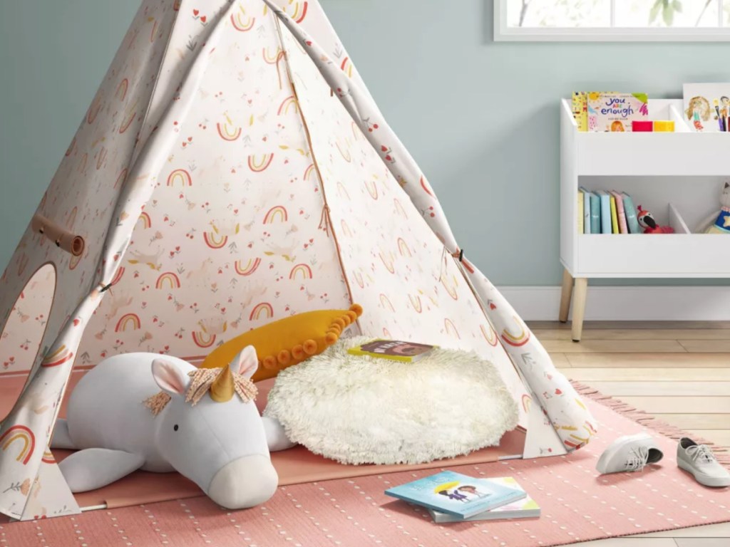 Pillowfort Unicorn Kids tent in bedroom surrounded by toys