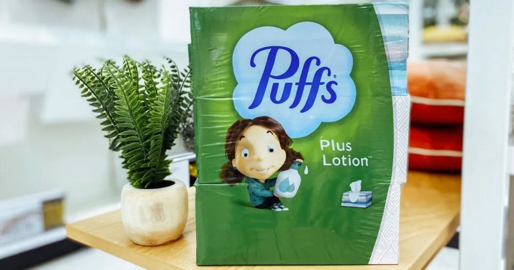 box of puffs tissues near potted plant