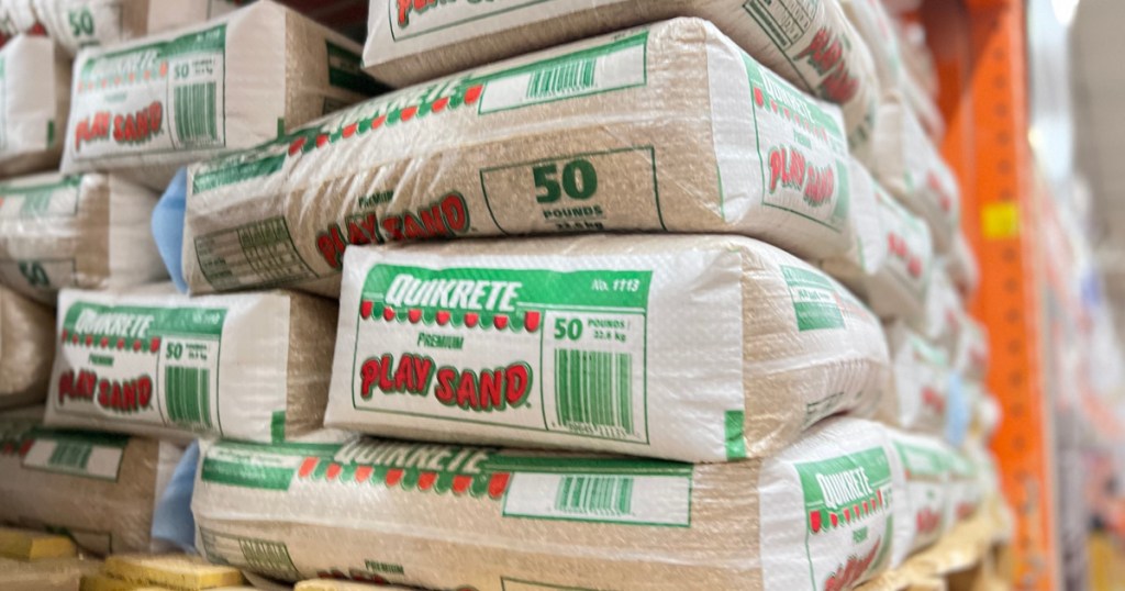 Bags of Quikrete Play Sand displayed in store