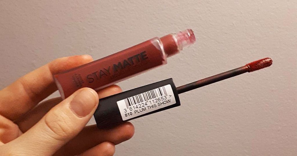 hand holding Rimmel Stay Matte Lip Liquid in Plum This Show