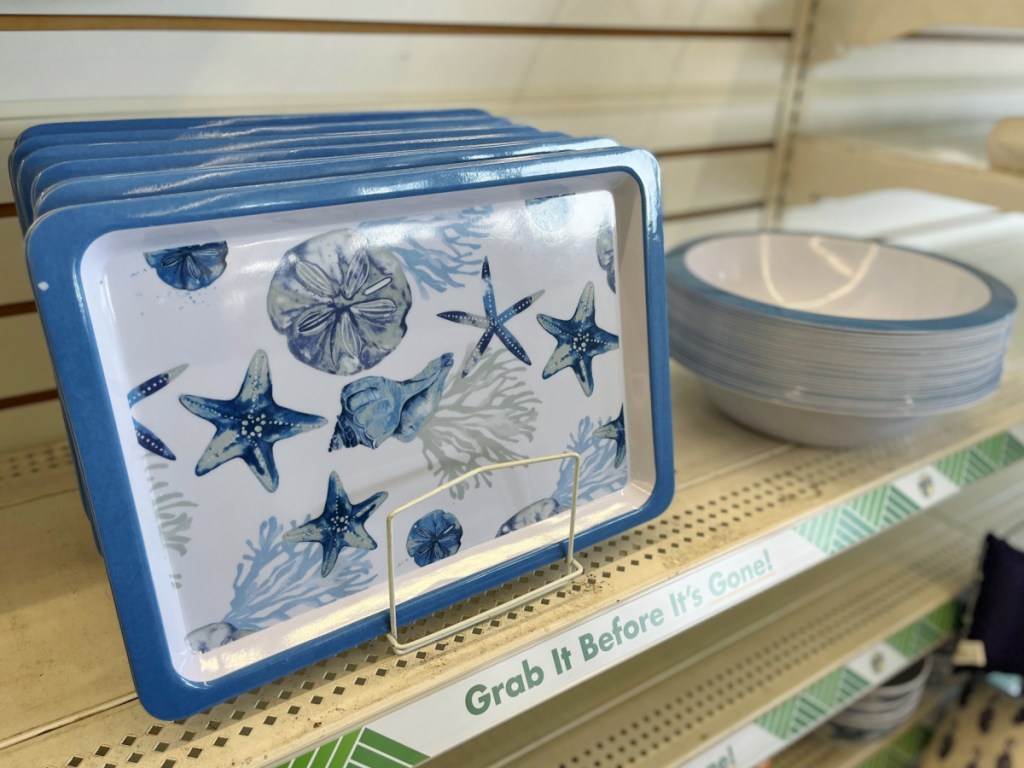 blue and white seashell serving trays on store shelf