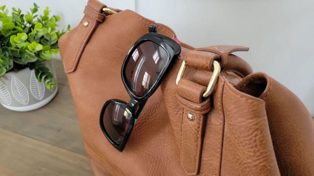 pair of sunglasses on a purse