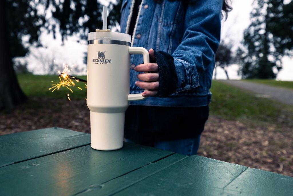 person holding a Stanley Tumbler