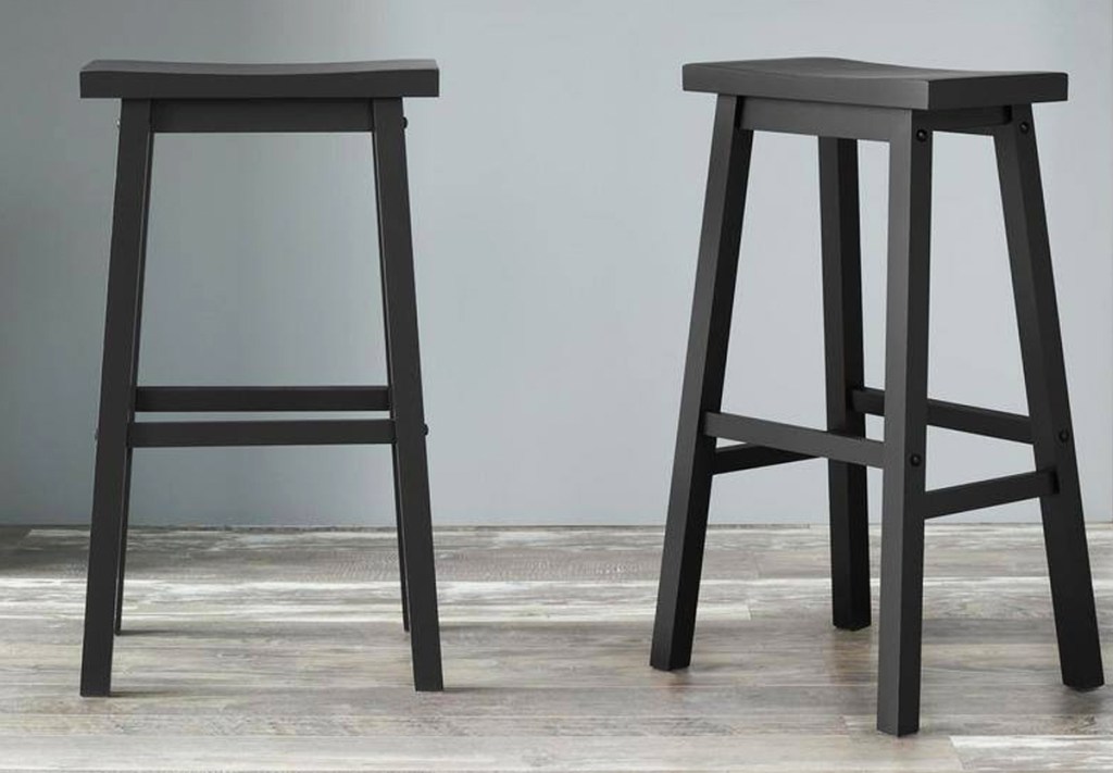 two black backless barstools