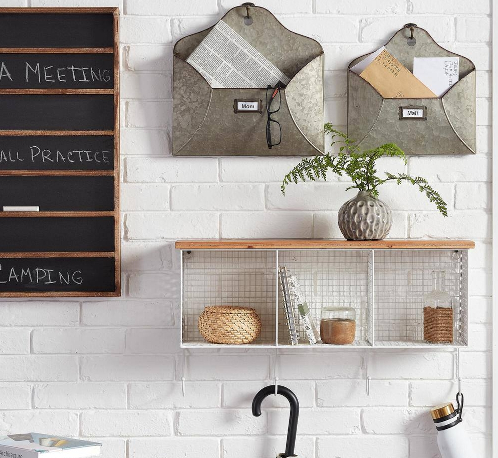 Metal shelf with hooks hanging on a wall