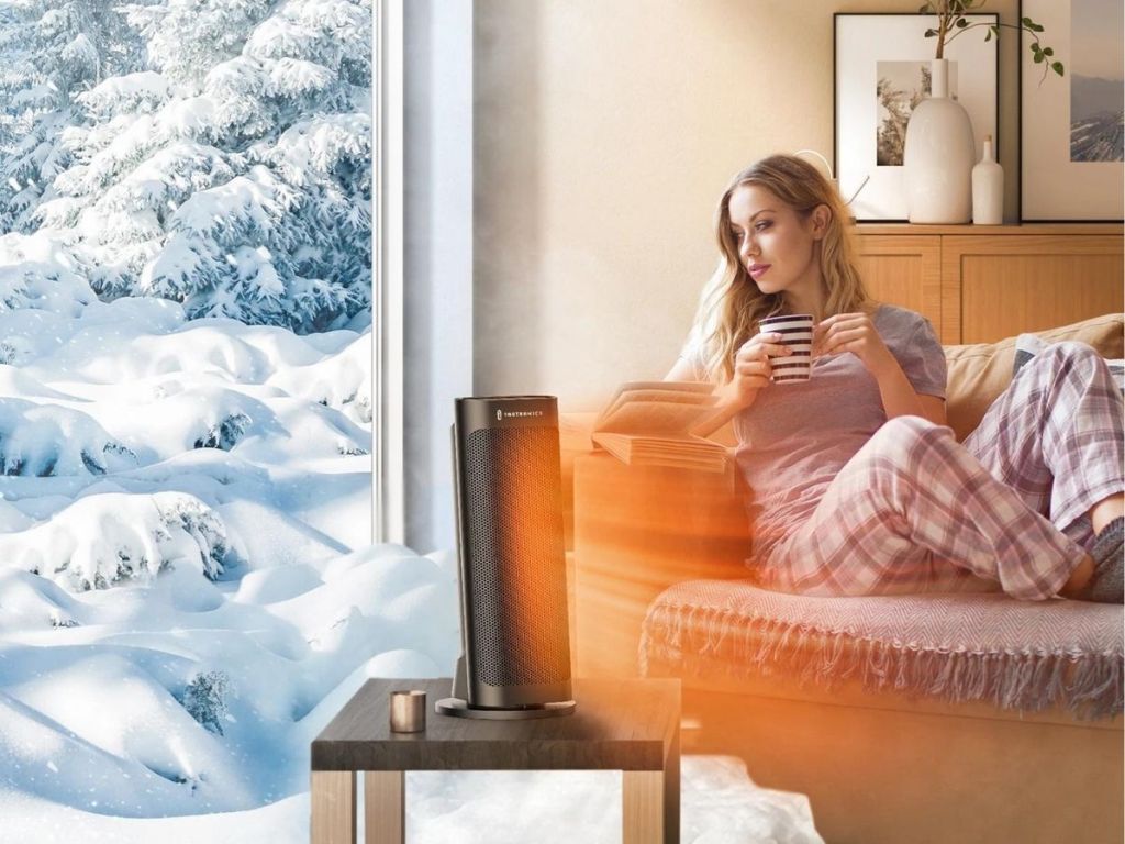 woman sitting on couch in front of Taotronics Oscillating Portable Space Heater