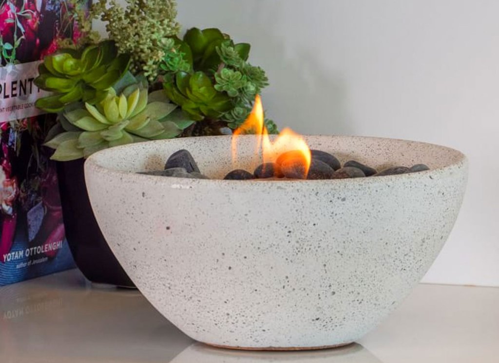 white fire bowl with flame