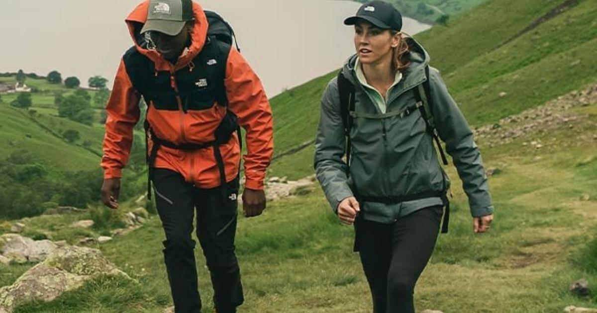 man and woman wearing the north face jackets