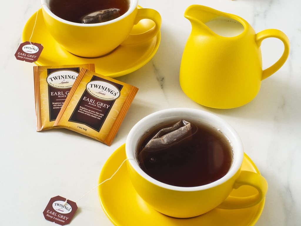 two yellow mugs of tea