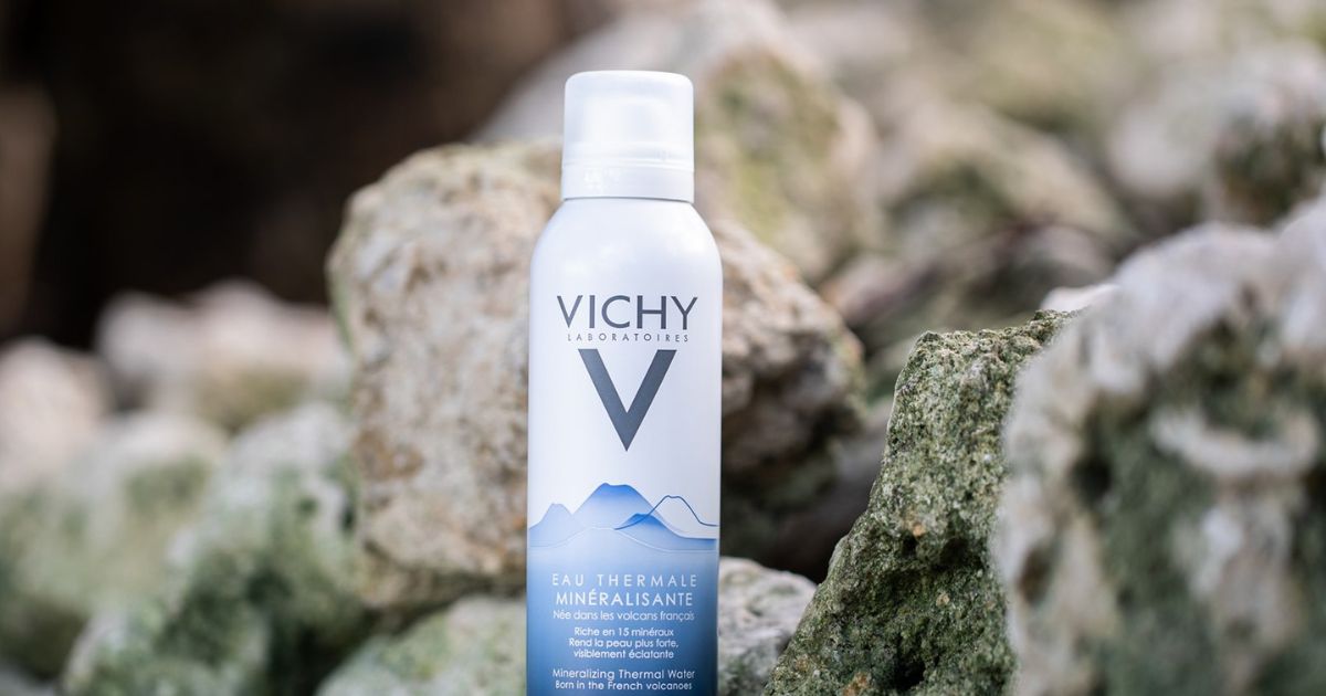 Vichy Water Spray sitting on rocks