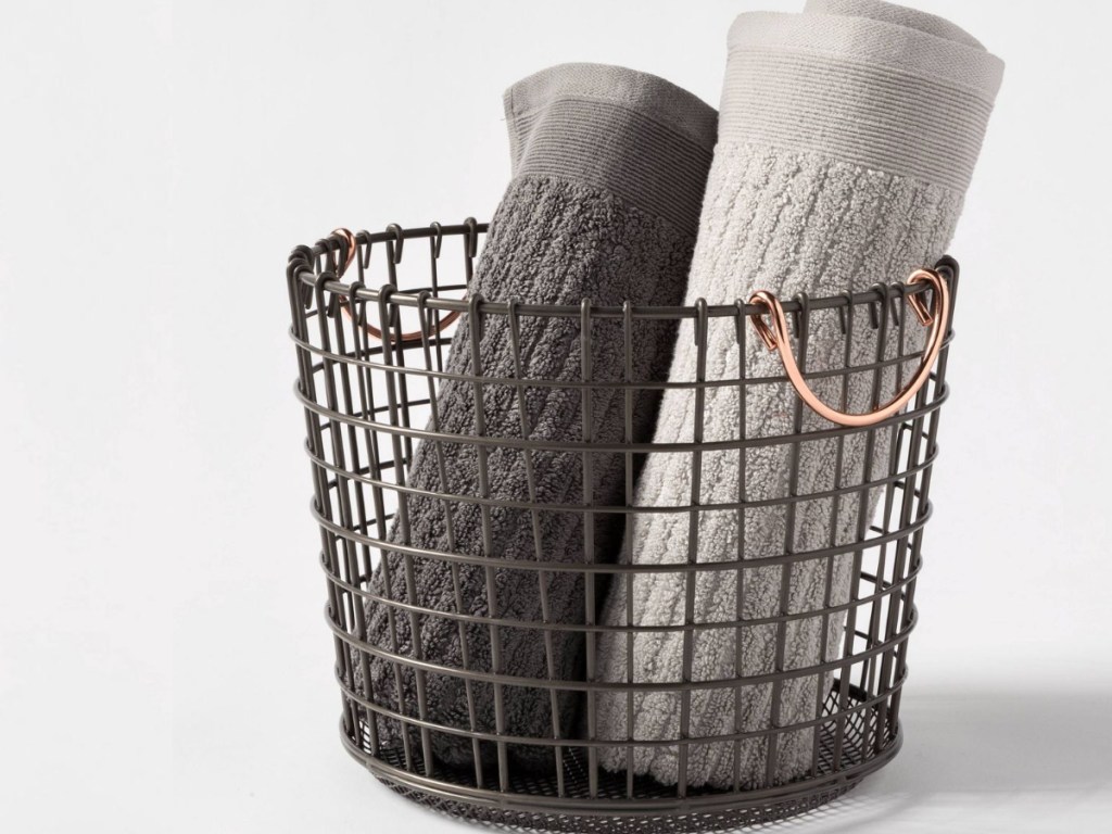 Wire basket with towels inside