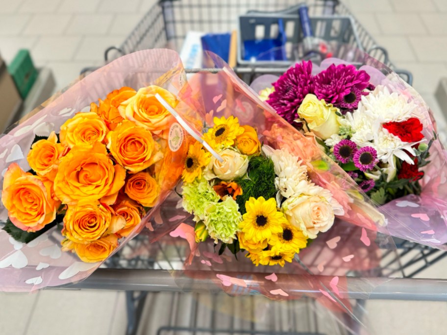 three flower bouquets in aldi shopping cart
