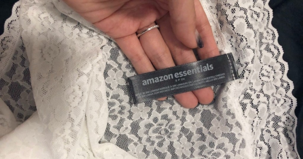 holding the tag of a pair of lace underwear