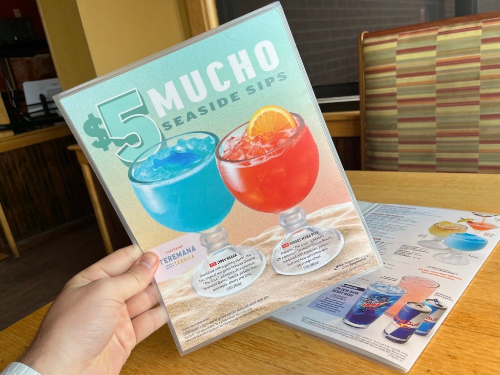 holding a drink menu from Applebee's
