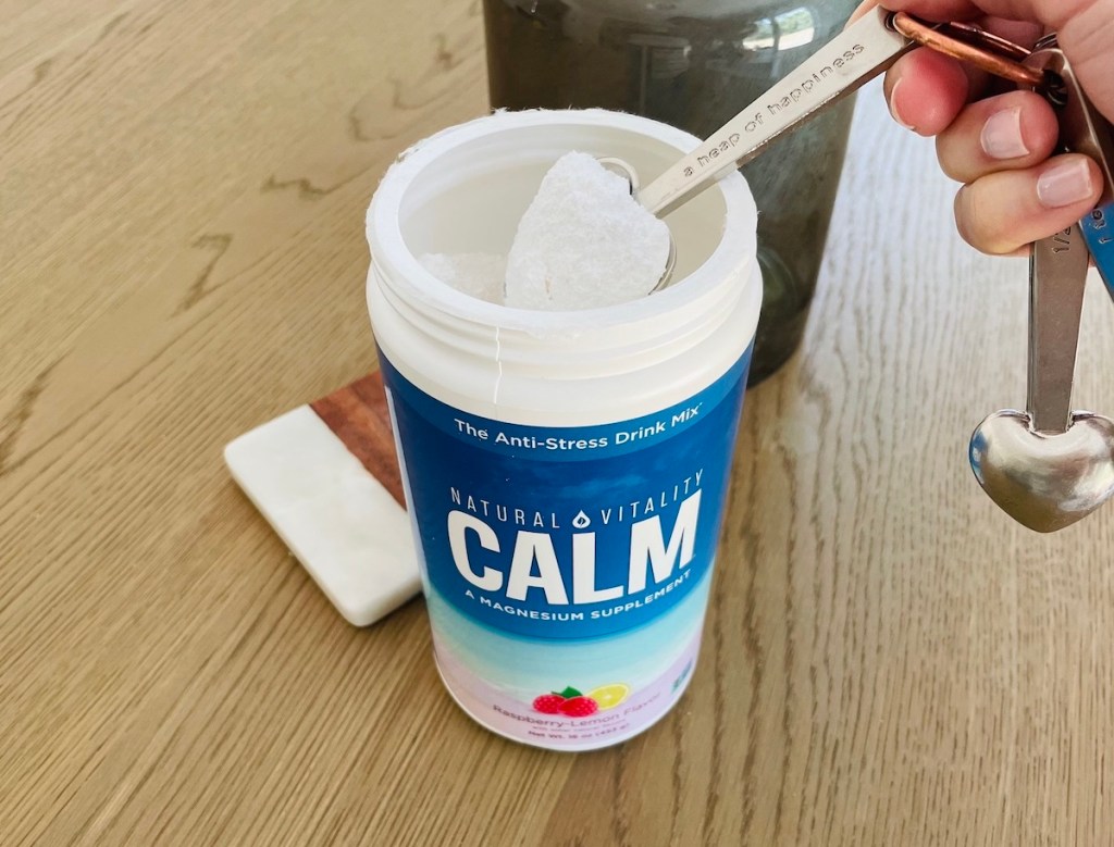 open canister of calm magnesium supplement powder