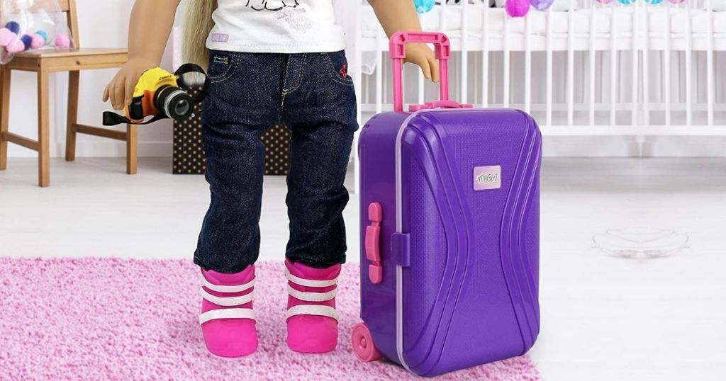 doll with purple luggage