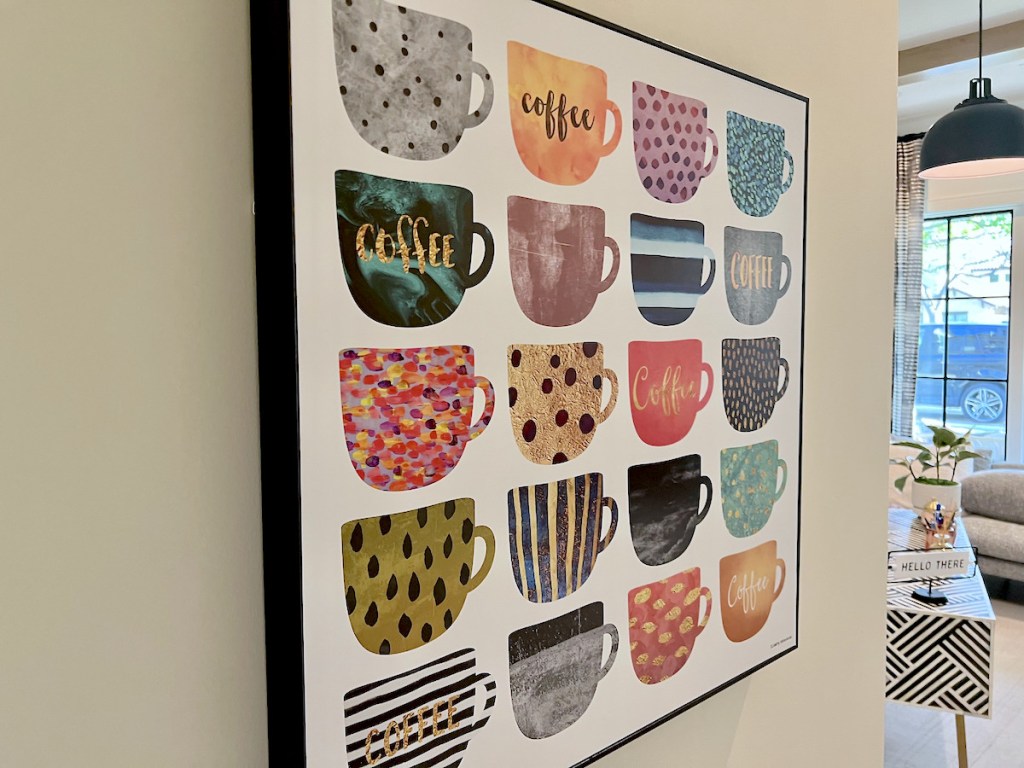 coffee mug prints on cream wall in office 