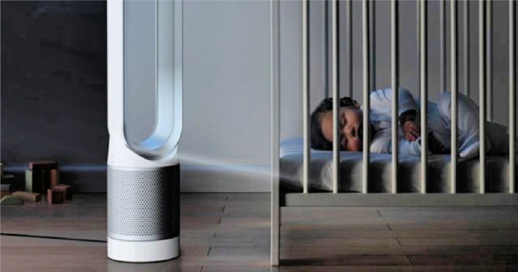 dyson tower fan and air purifier next to sleeping baby