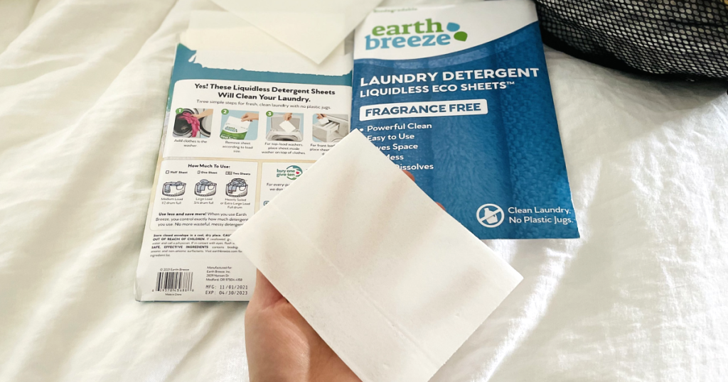 hand holding Earth Breeze laundry sheet