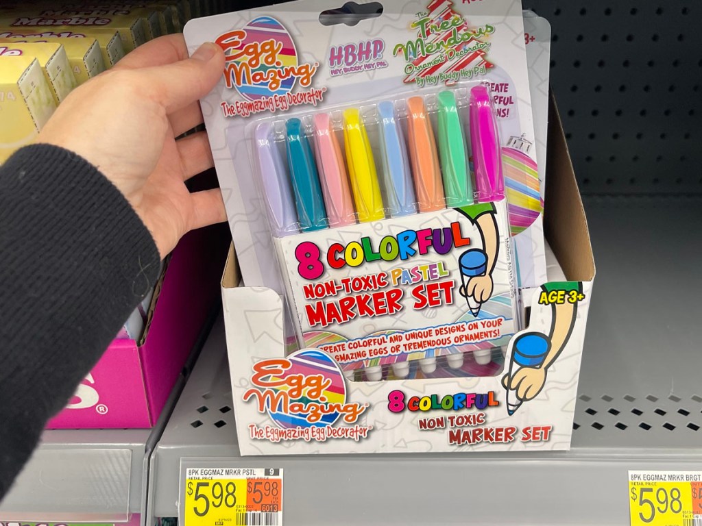 hand holding eggmazing markers package