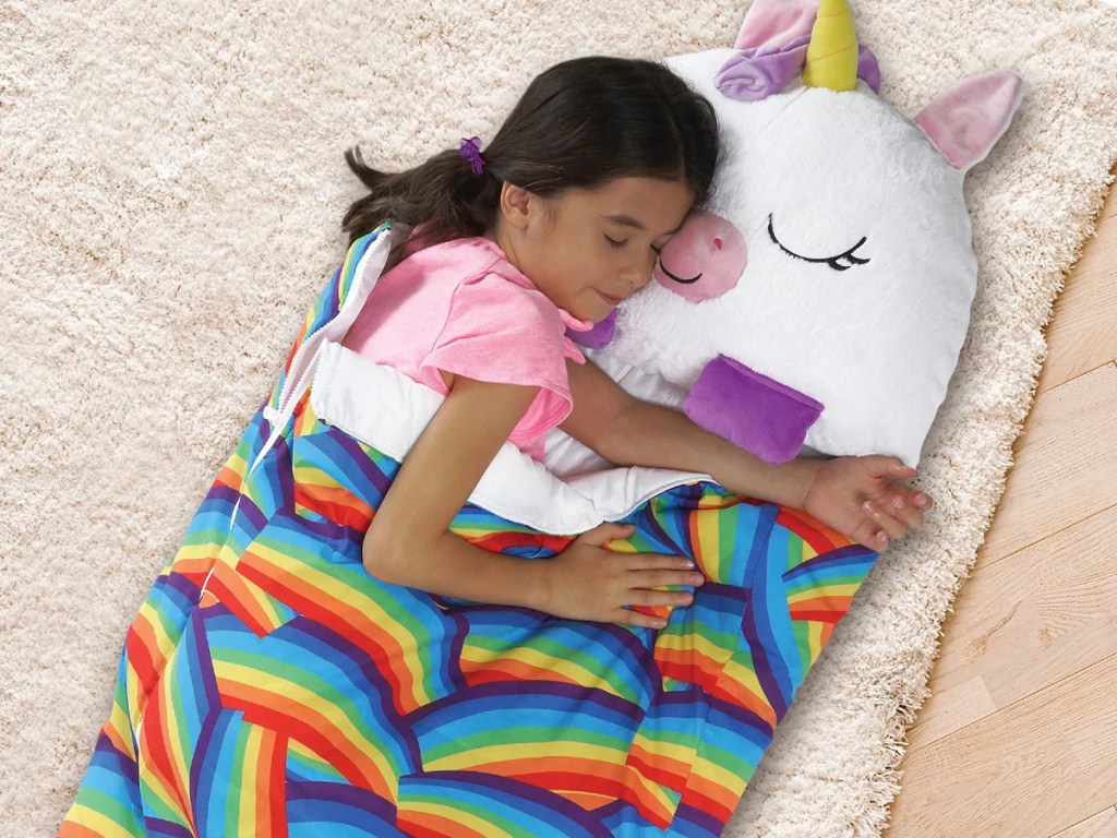 girl sleeping in a happy napper unicorn