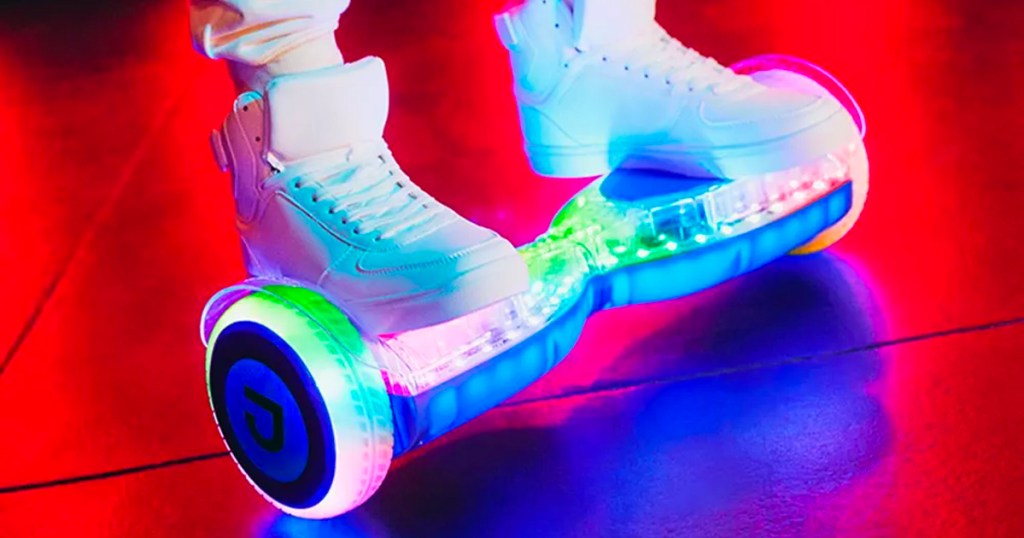 someone riding white led hoverboard