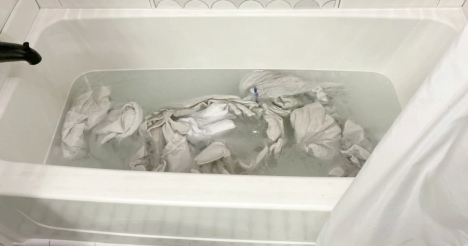 laundry stripping in the tub