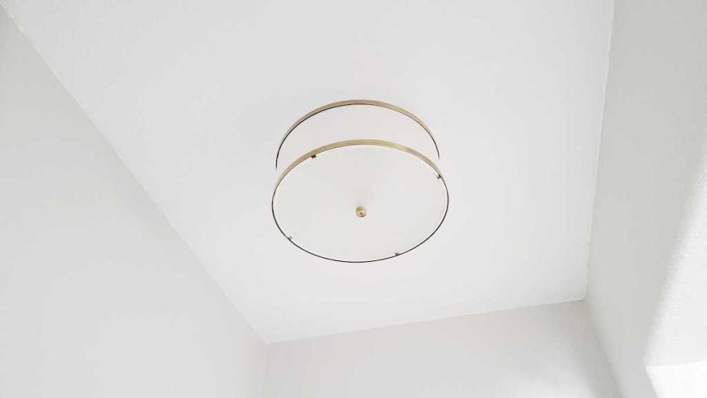 flush mount light fixture hanging from ceiling
