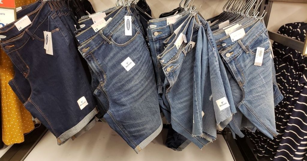 four rows of Old Navy women's denim shorts hanging in store