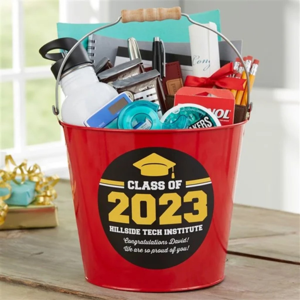 red gift bucket full of graduation gifts