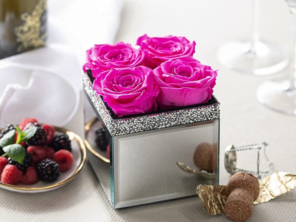 pink roses in a mirrored box