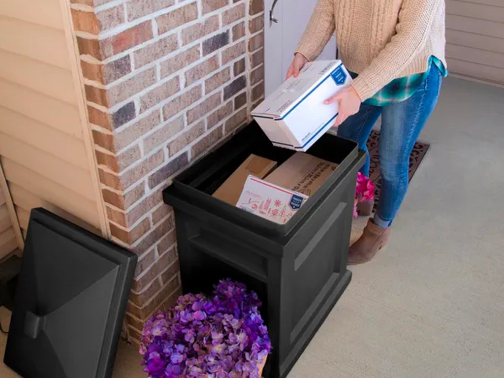 women taking mail out of delivery box