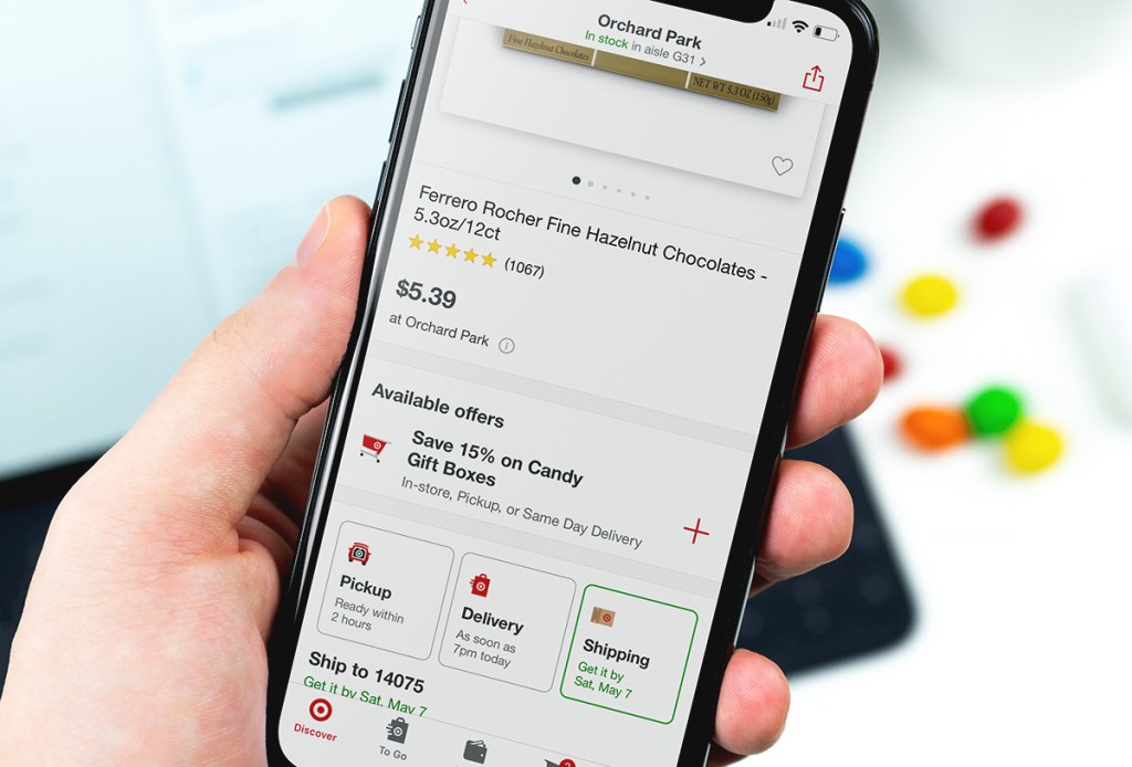 holding phone with target circle clippable coupon