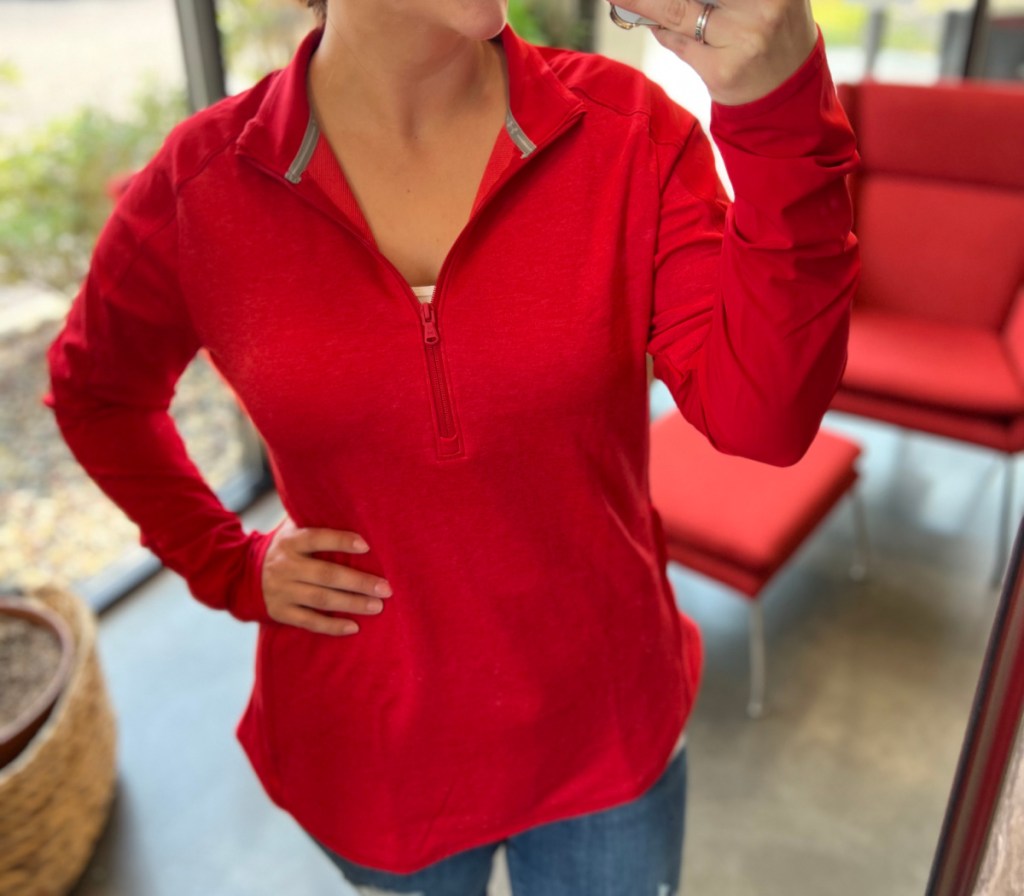 woman taking selfie in red jacket