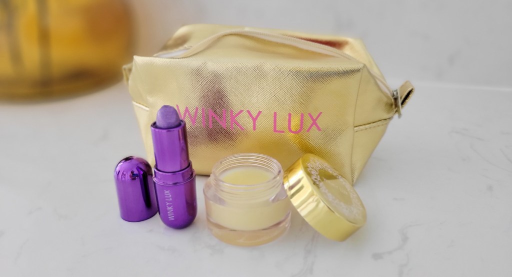 gold makeup bag with lip products