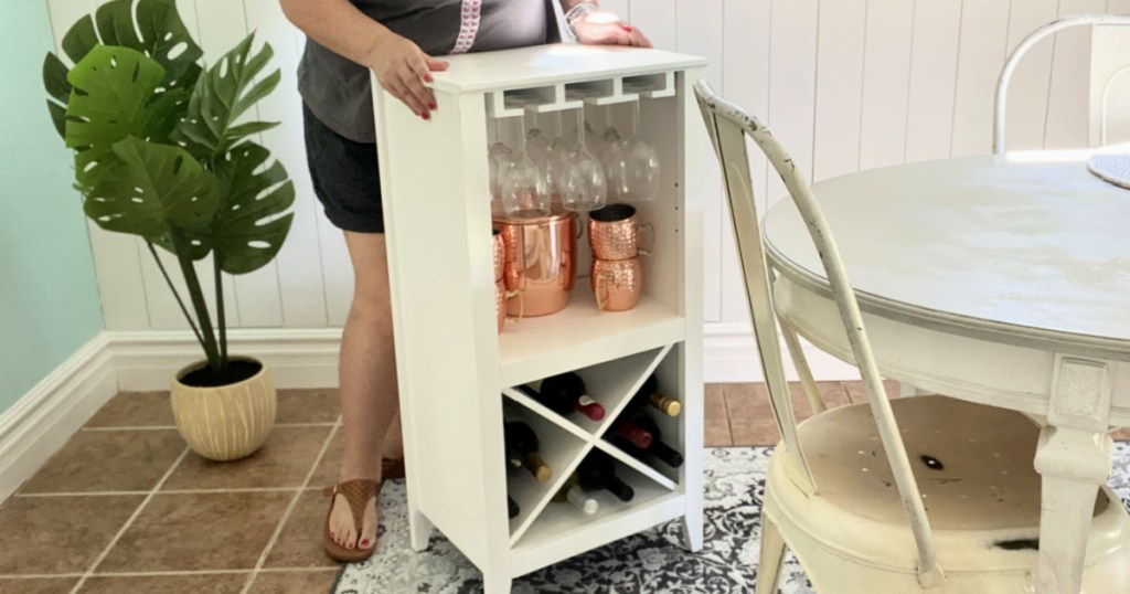 woman moving a wine rack