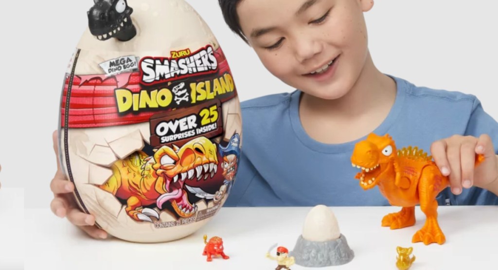 boy playing with dino toy