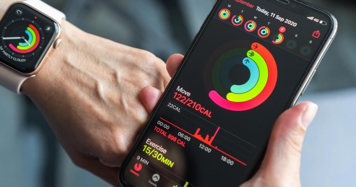 iphone and apple watch with apple fitness displayed