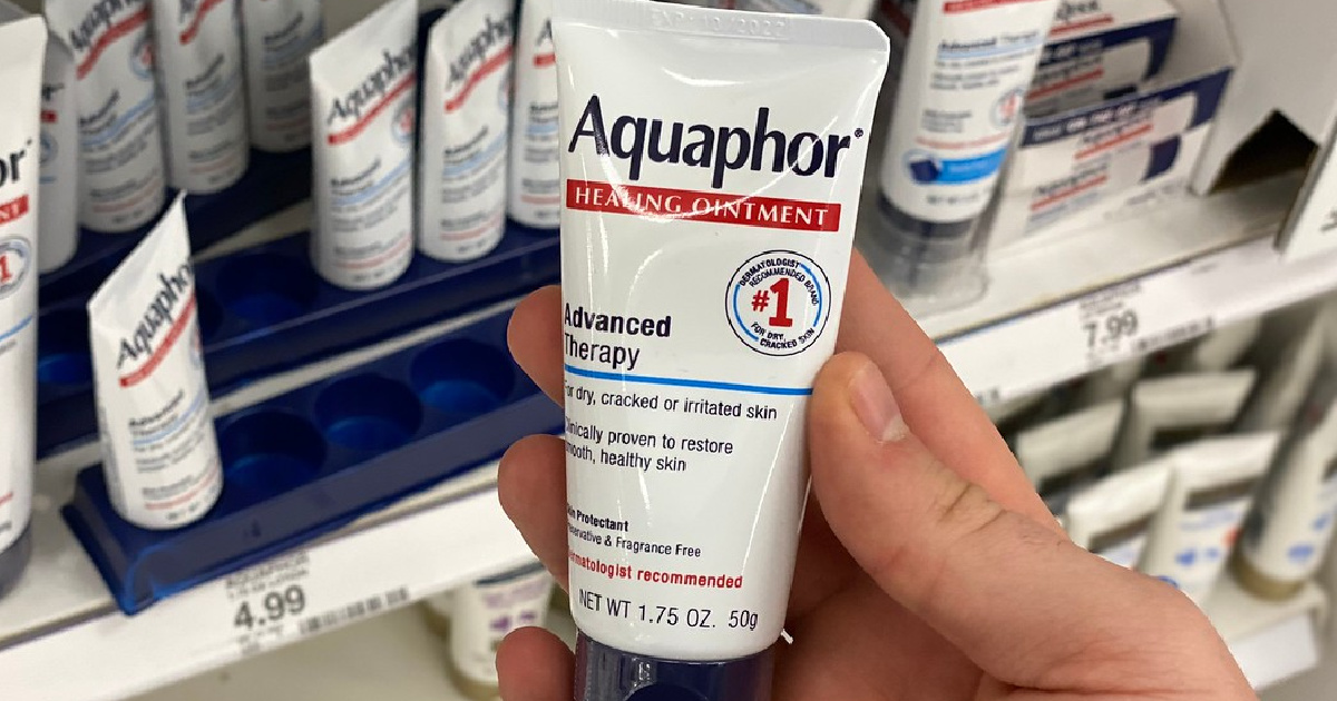 hand holding Aquaphor Ointment in store