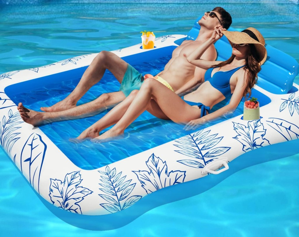 Two people in a BAIAI inflatable pool lounger raft