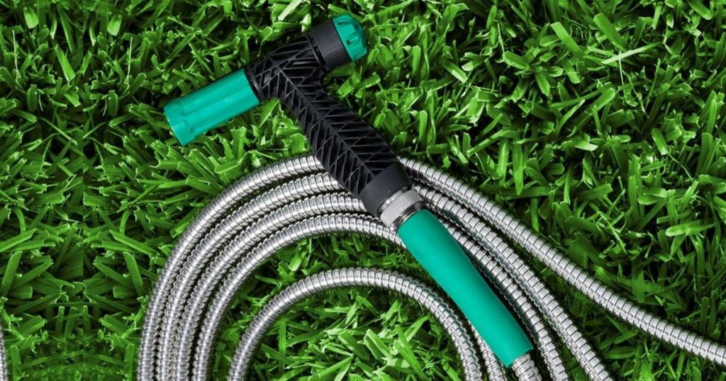 metal green hose in grass