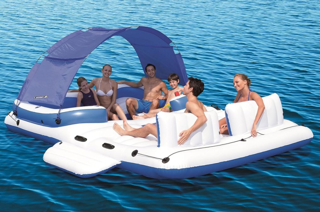 A family sitting on a Bestway Hydro Force Inflatable Island Raft